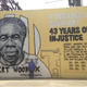Michel Mable stands in front of a mural of his brother, Albert Woodfox. The mural, painted by artist-activist Brandan “Bmike” Odums and created in conjunction with Amnesty International USA’s Art for Amnesty program, is located at 537 S. Claiborne Ave. in New Orleans.
Courtesy of Angola 3 News